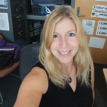 headshot of Deb Mole in her UAA library office