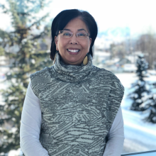 Headshot of Maria Williams in front of snowy trees